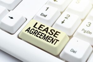 Close-up of a keyboard with a key labeled 'Lease Agreement' in place of a regular key.