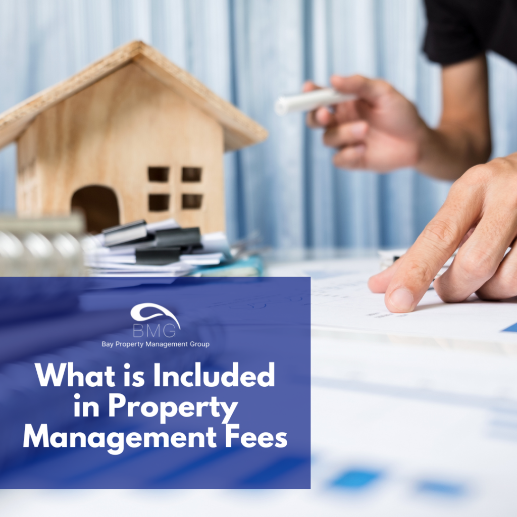 A person looks at papers next to a house, trying to understand what is included in his property management fees.