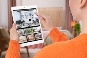 A woman scrolls through the website of a property management company and their listings.